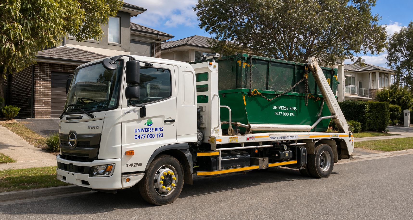 A Universe Bins truck delivering a green skip bin outside a home in a Melbourne suburb